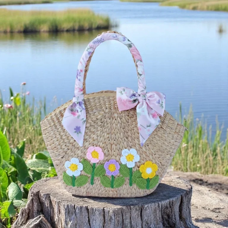 Lalita Eco-Friendly Straw Tote with Floral Embroidery – handmade natural straw bag with floral detail and curved handles
