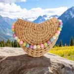 Somchai Eco-Friendly Half Moon Clutch with pastel beads, handmade from straw in Thailand
