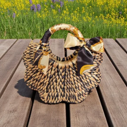 Tanakit Straw Eco-Friendly Black & Yellow Natural Beach Bag with curved shape and satin bow, handcrafted from Thai water hyacinth