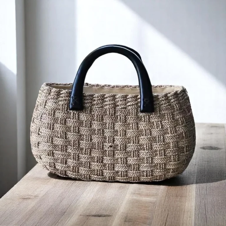 Chorakhe vegan woven handbag with wooden handles in basket-style weave.