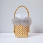 Nathamon Soft Trimmed Mini Straw Drawstring Bag with Misty Grey Feather Detail