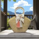 Sasiprapa Natural Woven Straw Bag With Peach Tassel & Silk Bow