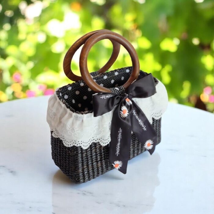 Black straw purse with wooden handles and lace trim