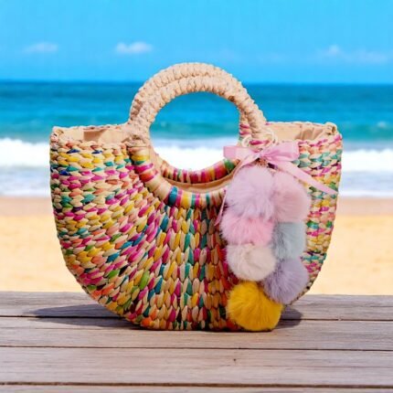 Rainbow straw beach bag with pom-poms and pink bow