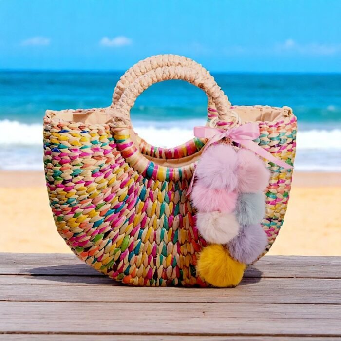 Rainbow straw beach bag with pom-poms and pink bow
