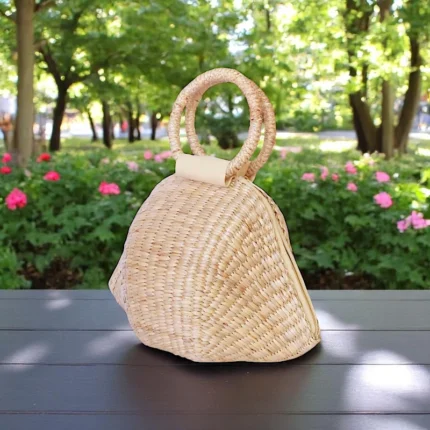 Structured straw designer handbag with round woven handles
