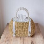 Chantra Pearl Handle Straw Bag with White Drawstring Lining – handmade mini straw tote with pearl bead handles and soft white cotton pouch, crafted in Thailand