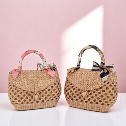 Namthip Straw Woven Bag with Bow Handle in pink and navy